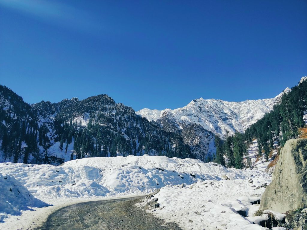 snow covered mountain under blue sky during daytime